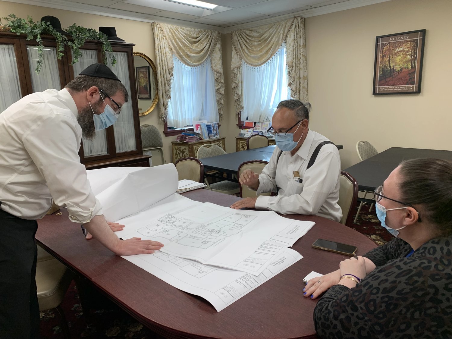 The Chabad of Merrick-Bellmore-Wantagh ran a successful campaign to raise funds for the expansion of its preschool. Above, Rabbi Shimon Kramer, left, looked over plans with an architect.